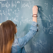 teenager-solving-equations-at-a-chalkboard-in-clas-2026-04-13-23-49-55-utc